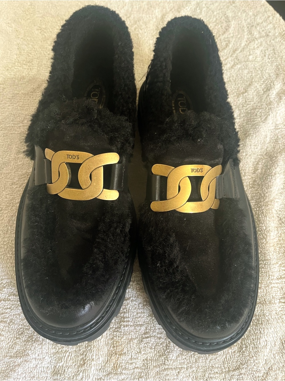 Tod's Black Leather Shearling-Trim Loafers with Gold Chain Detail